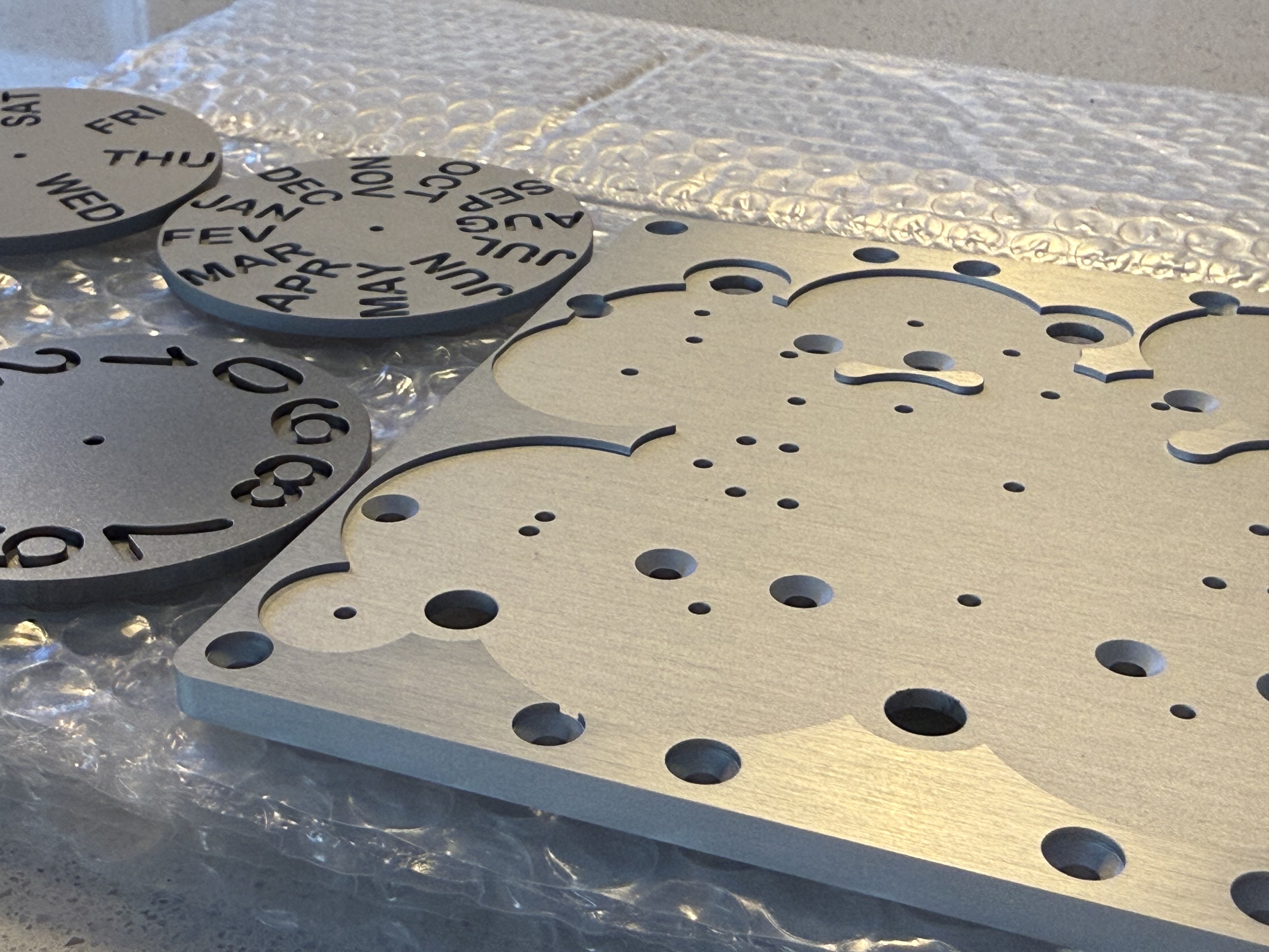 Precision-machined brass components and metal dial samples